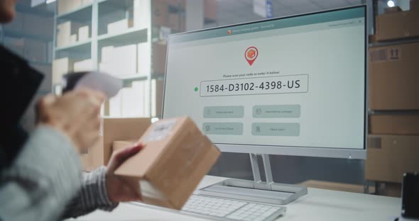 Female Postal Warehouse Associate Scanning Code Checking Parcel ...