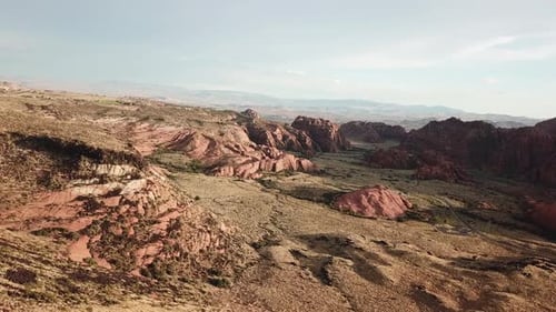 Cinematic Aerial View of Dry Desert Landscape in Snow Canyon State Park, Utah USA