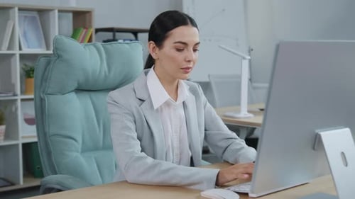 Focused Businesswoman Working on Computer in Office Female Manager Typing on Keyboard Business
