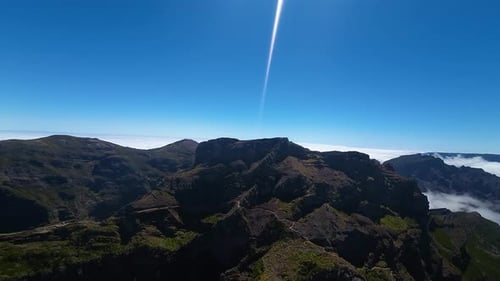 Madeira Island landscape. High altitude view from drone of mountain peaks above the clouds along Pic