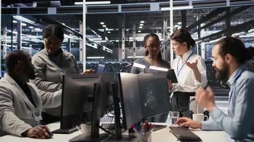 Data Center Teamworking Colleagues Performing Maintenance on Server Racks