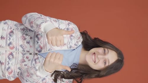 Smiling Teen Girl Gives Thumbs Up