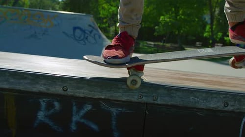 Close Up of Skateboarder Skateboarding in Skate Park
