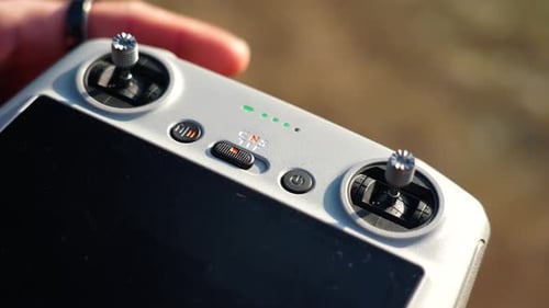 Close up of drone remote control, person change different flight modes