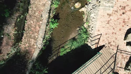 fly over a bridge top-down view in the old city of Tbilisi