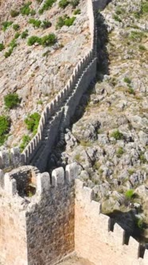 Vertical Video Coastal Challenge Scaling Alanya's Fortress with a Summer Vibe