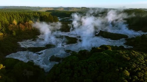 Majestic Geothermal Landscape with Steaming Pools and Forests
