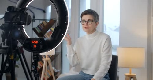 Middle Aged Lady Records Talking Video Course in Studio