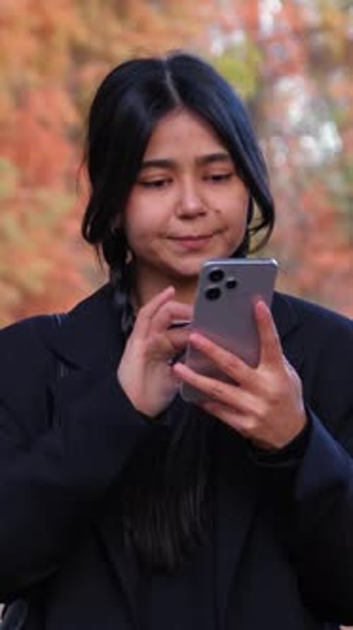 With Elegance and Ease a Techsavvy Individual Types on Their Smartphone Blending Modern Technology
