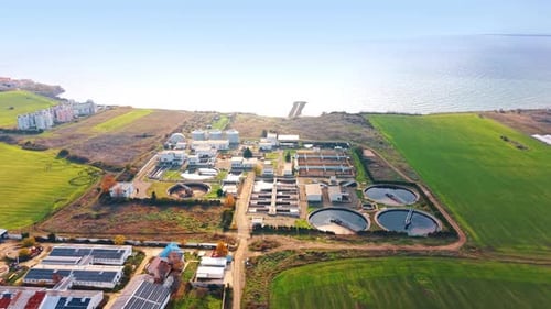 Large wastewater treatment plant in the fields at the seashore.