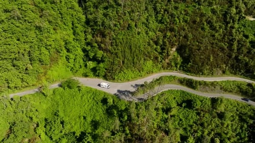 Aerial view rotating away from a RV driving in Cinque Terre, summer day in Italy
