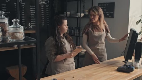 Young Women Co-working In Cafe