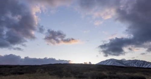 Timelapse of Epic Clouds at Mountain Medow at Autumn Time Wild Endless Nature with Snow Storm Sky