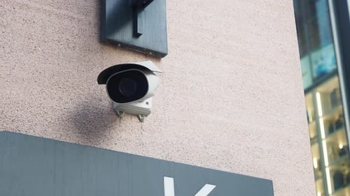 CCTV Security Camera Operating on Building