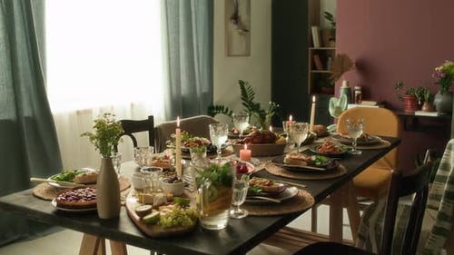 Elegant Table Set with Food and Candles