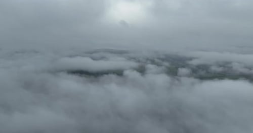 Scenic Aerials of Tranquil White Clouds Above Landscape