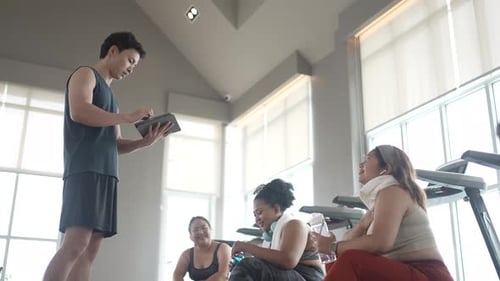 chubby women workout at fitness center.