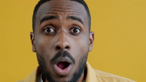 Shocked Young Man with Beard Reacting