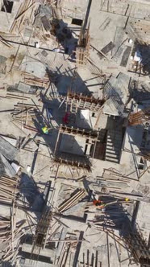 Aerial View of Construction Site with Two Workers