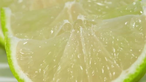 Close up of Lime Slices, Rotation in Circle. Lime Green