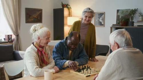 Seniors Enjoying Chess Game Together Indoors