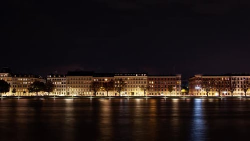 Copenhagen Night Cityscape Timelapse with Illuminated Water Reflection