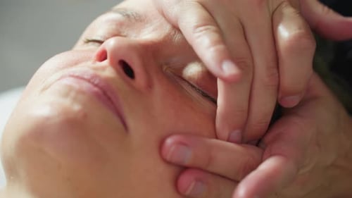 Close Up Facial Smoothing Massage Under Soothing Spa Light