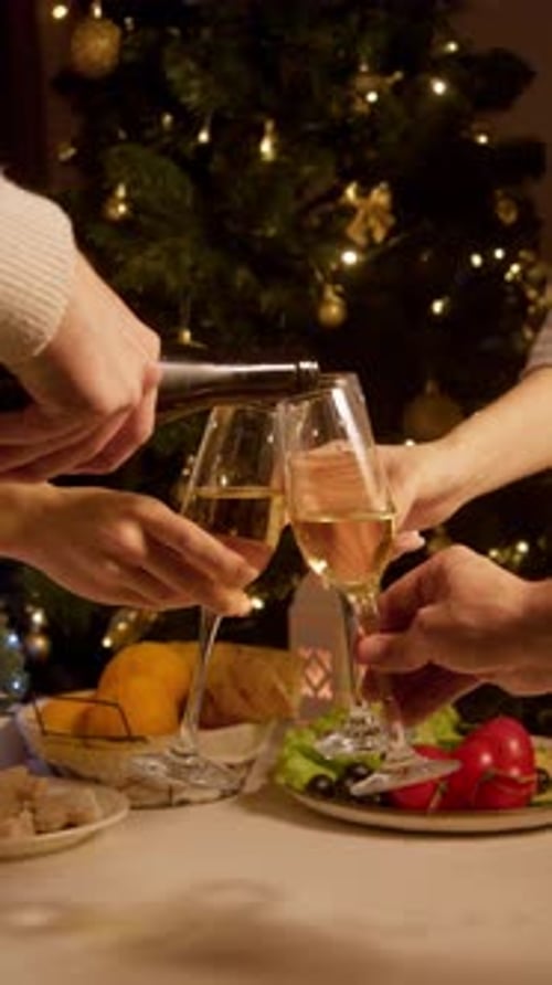 Celebration of New Year and Christmas Glasses are Filled with Champagne and Group of Friends