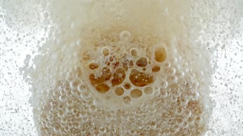 Closeup Effervescent Tablet Vitamin White Pill Dissolves with Bubbles Round Bubbling Aspirin in