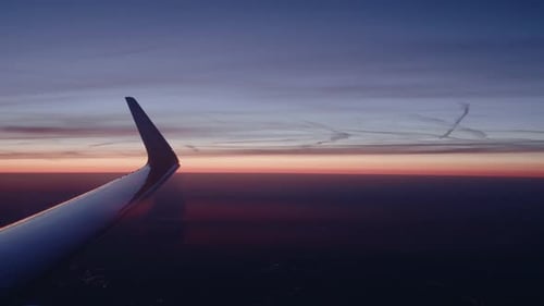 Airplane flying over city