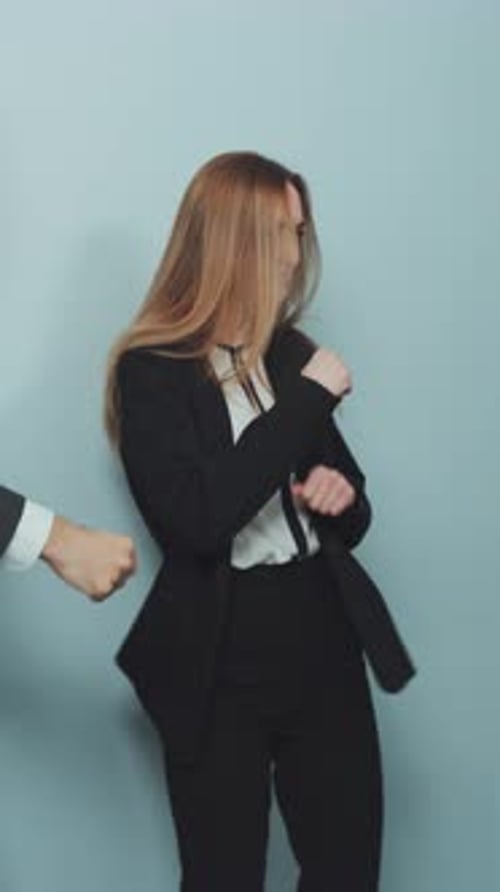 Enthusiastic Business People Dancing in Workplace