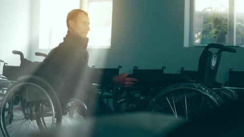 A Disabled Man Assembles a Stroller