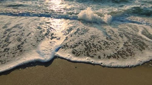 Sea Waves Rolling on Sandy Shore Beach on Sea Coast Dawn Sunset Blue Sea Waves