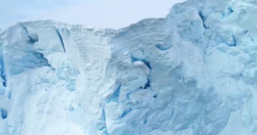 Snow Covered Blue Ice Wall Iceberg in Antarctica