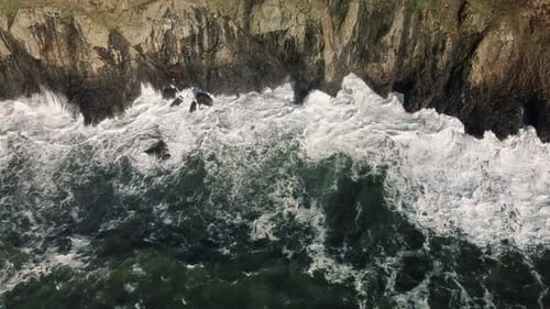Drone Flying Along Washington Coast With Waves Splashing Rocky Cliffs