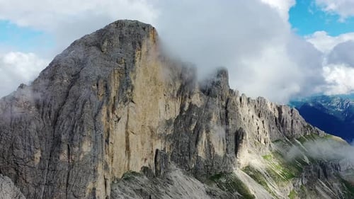 Aerial View of Dolomites Mountain Peaks Shrouded in Clouds on a Sunny Day South Tyrol Italy
