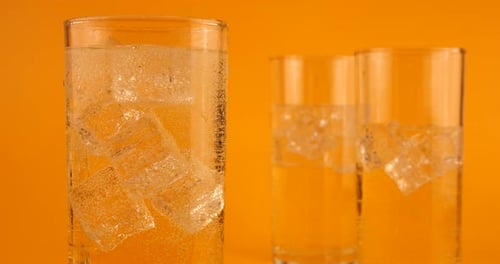 Refreshing Drink Poured Into Glass With Ice