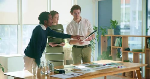 Creative, office and people with documents in discussion for company, planning and brainstorming