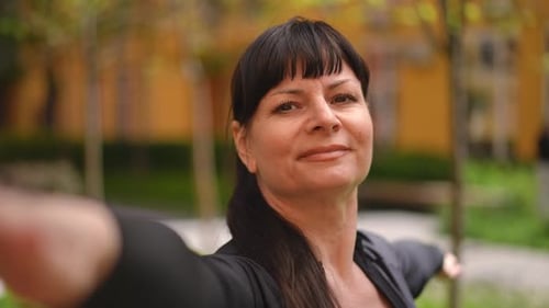 Woman Stretching Arms in Urban Park Close Up