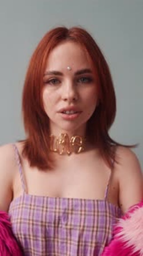 Young Woman Poses in Fashionable Outfit