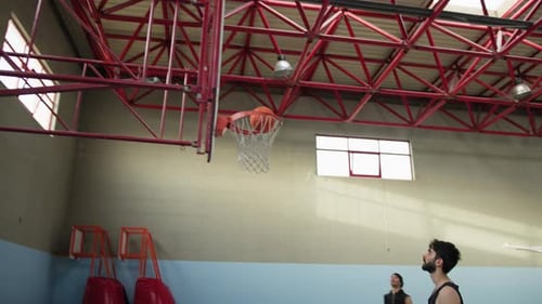 Two Basketball Players Train In The Internal Court For The Match