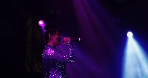 Woman Singer Performing Live on Stage