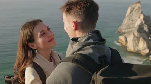 Loving Couple Embracing Near Ocean Cliffs