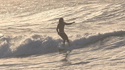 Surfer Riding on Surfboard in Beautiful Ocean Waves Slow Motion