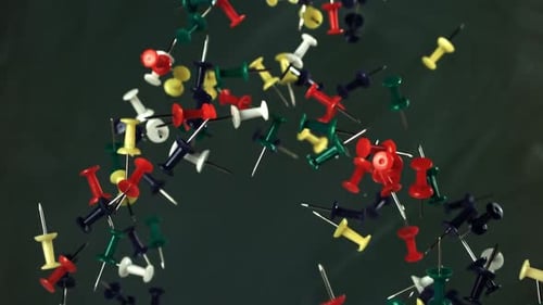 Multicolored Paper Clips Fly Up and Fall Down Filmed on a Highspeed Camera at 1000 Fps