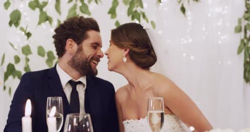 Bride and Groom Kiss at Wedding Reception