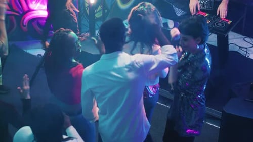 Energetic Young Adults Dancing at Night Party