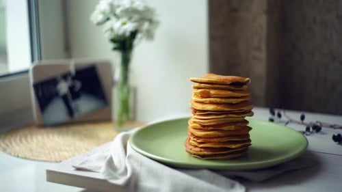 Stack of Tasty Pancakes with Butter on Top