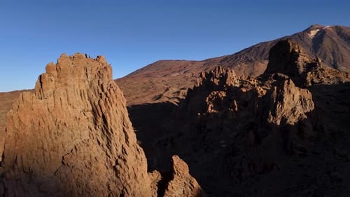 Majestic Aerial Drone View of Rugged Mountain Peaks at Sunset