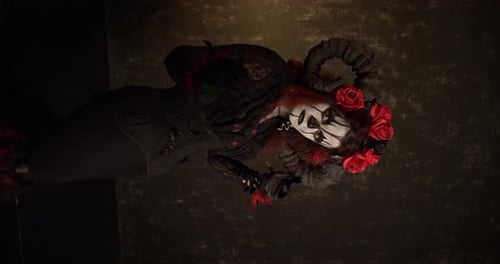 Woman Posing in Goth Fashion with Dia Makeup